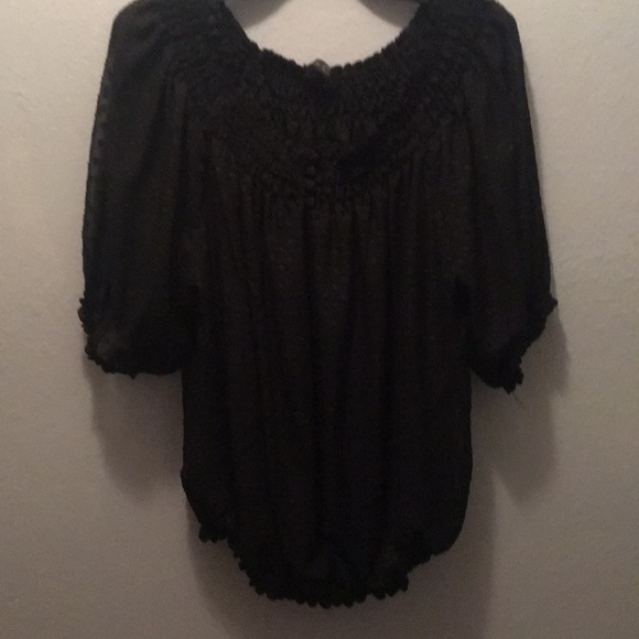 Black blouse with elastic button. - Picture 1 of 3